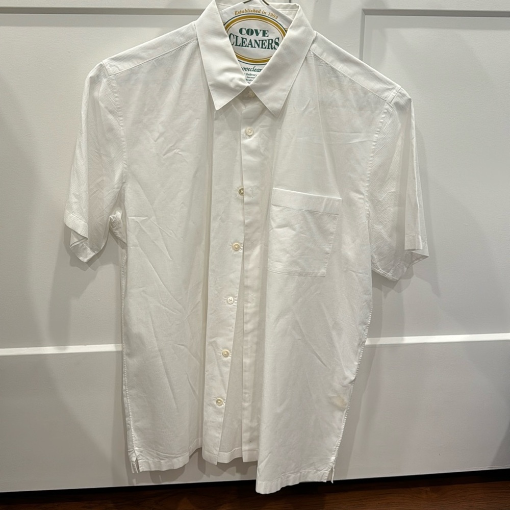 Theory. White, button down short sleeved with pocket on left breast.